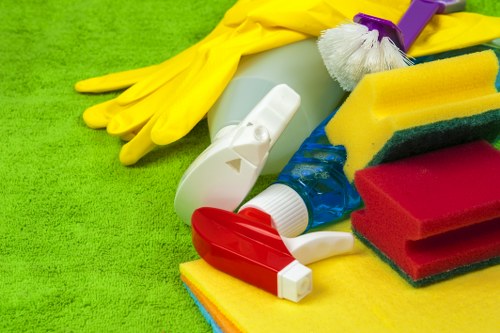 Technician performing hot water extraction on a carpeted floor